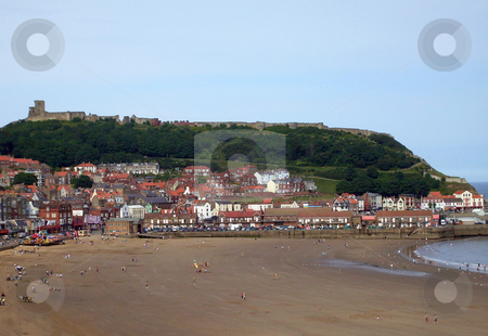 To use this stock image in your creative project, please select the size you need over to the right and click the "Add to Cart" button.
Your downloaded image will come with the Cutcaster watermark removed so don’t worry about the watermark you see on this page. Seaside scenery England stock photo, Castle and beach in Scarborough, England. by Martin Crowdy