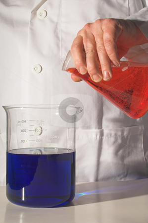 To use this stock image in your creative project, please select the size you need over to the right and click the "Add to Cart" button.
Your downloaded image will come with the Cutcaster watermark removed so don’t worry about the watermark you see on this page. Scientist stock photo, A scientist working with chemicals in a laboratory. by Robert Byron