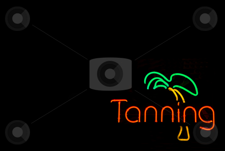 To use this stock image in your creative project, please select the size you need over to the right and click the "Add to Cart" button.
Your downloaded image will come with the Cutcaster watermark removed so don’t worry about the watermark you see on this page. Neon Tanning Sign stock photo, A colorful neon sign advertising a tanning booth. by Robert Byron