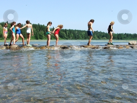 To use this stock image in your creative project, please select the size you need over to the right and click the "Add to Cart" button.
Your downloaded image will come with the Cutcaster watermark removed so don’t worry about the watermark you see on this page. Girls Crossing the Mississippi stock photo, Young girls walk carefully over the slippery rocks at the source of the Mississippi River in Minnesota's Itasca State Park. This spot, located in northern Minnesota, is a summertime favorite of kids and adults alike. by Dennis Thomsen
