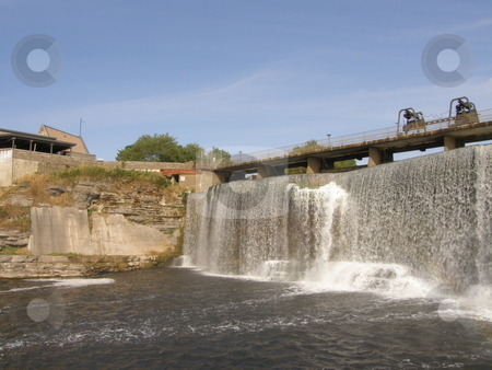 To use this stock image in your creative project, please select the size you need over to the right and click the "Add to Cart" button.
Your downloaded image will come with the Cutcaster watermark removed so don’t worry about the watermark you see on this page. Rideau Falls in Ottawa stock photo, Rideau Falls in Ottawa, Canada by Ritu Jethani