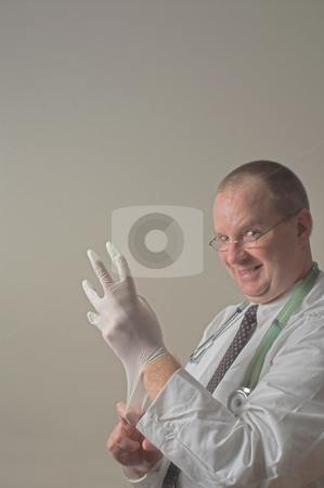 To use this stock image in your creative project, please select the size you need over to the right and click the "Add to Cart" button.
Your downloaded image will come with the Cutcaster watermark removed so don’t worry about the watermark you see on this page. Proctologist stock photo, A proctologist preparing for a patient examination. by Robert Byron