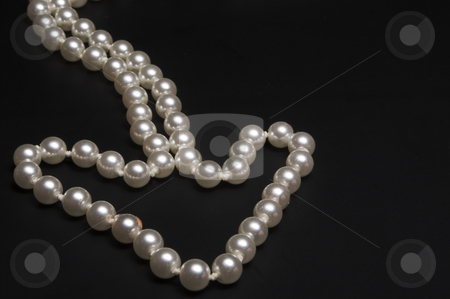 To use this stock image in your creative project, please select the size you need over to the right and click the "Add to Cart" button.
Your downloaded image will come with the Cutcaster watermark removed so don’t worry about the watermark you see on this page. Pearl Arrow stock photo, A string of pearls arranged in the shape of an arrow. by Robert Byron