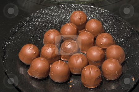 To use this stock image in your creative project, please select the size you need over to the right and click the "Add to Cart" button.
Your downloaded image will come with the Cutcaster watermark removed so don’t worry about the watermark you see on this page. Chocolate Cordials stock photo, An assortment of deliciously sweet chocolate cordials. by Robert Byron