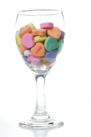 To use this stock image in your creative project, please select the size you need over to the right and click the "Add to Cart" button.
Your downloaded image will come with the Cutcaster watermark removed so don’t worry about the watermark you see on this page. Conversation Hearts stock photo, A wine glass full of valentine conversation hearts. by Robert Byron