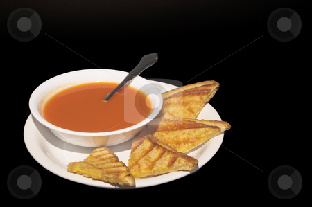 To use this stock image in your creative project, please select the size you need over to the right and click the "Add to Cart" button.
Your downloaded image will come with the Cutcaster watermark removed so don’t worry about the watermark you see on this page. Soup and Sandwich stock photo, A grilled cheese sandwich and a bowl of tomato soup. by Robert Byron