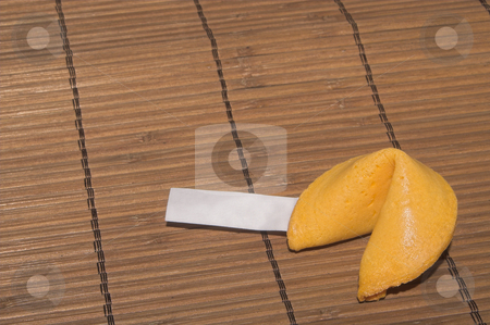 To use this stock image in your creative project, please select the size you need over to the right and click the "Add to Cart" button.
Your downloaded image will come with the Cutcaster watermark removed so don’t worry about the watermark you see on this page. Fortune Cookie stock photo, A fortune cookie on a bamboo mat. by Robert Byron