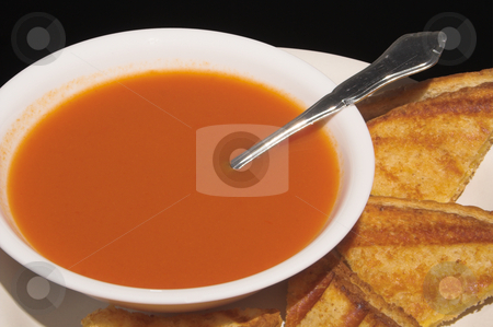 To use this stock image in your creative project, please select the size you need over to the right and click the "Add to Cart" button.
Your downloaded image will come with the Cutcaster watermark removed so don’t worry about the watermark you see on this page. Soup and Sandwich stock photo, A grilled cheese sandwich and a bowl of tomato soup. by Robert Byron