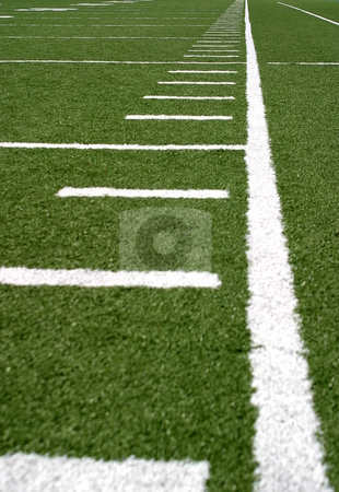 To use this stock image in your creative project, please select the size you need over to the right and click the "Add to Cart" button.
Your downloaded image will come with the Cutcaster watermark removed so don’t worry about the watermark you see on this page. Football Lines stock photo, Green football field with large yard markers. by Henrik Lehnerer