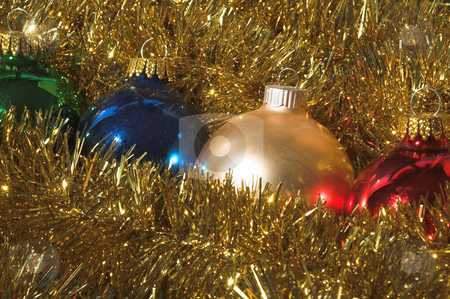 To use this stock image in your creative project, please select the size you need over to the right and click the "Add to Cart" button.
Your downloaded image will come with the Cutcaster watermark removed so don’t worry about the watermark you see on this page. Christmas Ornaments stock photo, A row of Christmas ornaments in holiday garland. by Robert Byron