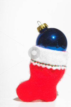 To use this stock image in your creative project, please select the size you need over to the right and click the "Add to Cart" button.
Your downloaded image will come with the Cutcaster watermark removed so don’t worry about the watermark you see on this page. Christmas Stocking stock photo, A Christmas stocking loaded with a Christmas ornament. by Robert Byron