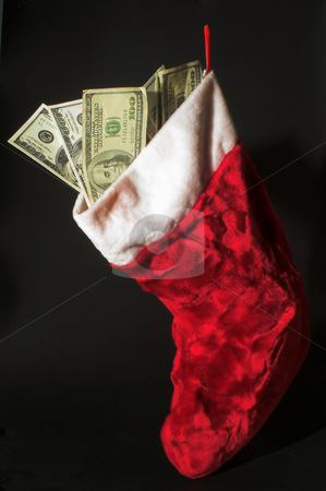To use this stock image in your creative project, please select the size you need over to the right and click the "Add to Cart" button.
Your downloaded image will come with the Cutcaster watermark removed so don’t worry about the watermark you see on this page. Christmas Money stock photo, A red Christmas stocking loaded with cash. by Robert Byron