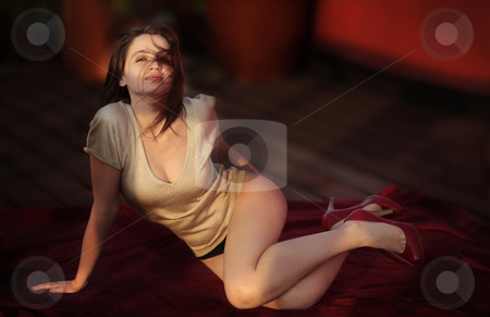 To use this stock image in your creative project, please select the size you need over to the right and click the "Add to Cart" button.
Your downloaded image will come with the Cutcaster watermark removed so don’t worry about the watermark you see on this page. Fun in the sun stock photo, Woman relaxing in the sun with red high hills with nude sexy legs on a blanket outdoors by Claudia Veja