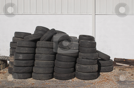 To use this stock image in your creative project, please select the size you need over to the right and click the "Add to Cart" button.
Your downloaded image will come with the Cutcaster watermark removed so don’t worry about the watermark you see on this page. Old Tires stock photo, A oile of old tires outside of an auto shop. by Robert Byron
