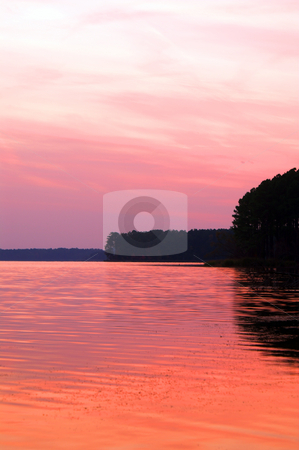 To use this stock image in your creative project, please select the size you need over to the right and click the "Add to Cart" button.
Your downloaded image will come with the Cutcaster watermark removed so don’t worry about the watermark you see on this page. Sunset Lake stock photo, A lake just after sunset with the reflection of a beautiful orange sky. by Robert Byron