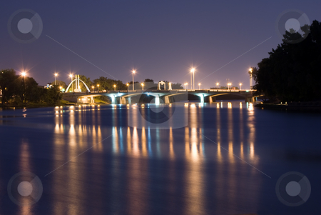 To use this stock image in your creative project, please select the size you need over to the right and click the "Add to Cart" button.
Your downloaded image will come with the Cutcaster watermark removed so don’t worry about the watermark you see on this page. City Bridge at Night stock photo, A view of a city bridge with reflections on the river by Richard Nelson