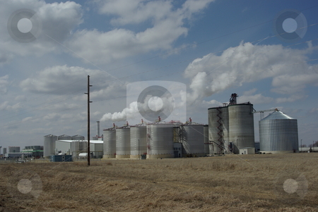 To use this stock image in your creative project, please select the size you need over to the right and click the "Add to Cart" button.
Your downloaded image will come with the Cutcaster watermark removed so don’t worry about the watermark you see on this page. Iowa Biofuels Plant stock photo, Iowa leads the nation in the number of biofuel production facilities making ethanol from corn with 25 now in operation. Seventeen more plants are under construction or in planning stages. This ethonal plant is located in northeast Iowa on the edge of rural Fairbank (04/02/2008). by Dennis Thomsen