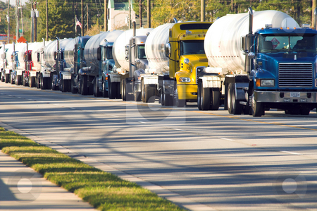 To use this stock image in your creative project, please select the size you need over to the right and click the "Add to Cart" button.
Your downloaded image will come with the Cutcaster watermark removed so don’t worry about the watermark you see on this page. Convoy stock photo, A convoy of diesel freight tanker trucks. by Robert Byron
