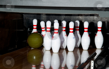To use this stock image in your creative project, please select the size you need over to the right and click the "Add to Cart" button.
Your downloaded image will come with the Cutcaster watermark removed so don’t worry about the watermark you see on this page. Bowling stock photo, A ball striking a set of pins on a bowling alley. by Robert Byron