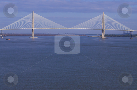 To use this stock image in your creative project, please select the size you need over to the right and click the "Add to Cart" button.
Your downloaded image will come with the Cutcaster watermark removed so don’t worry about the watermark you see on this page. Suspension Bridge stock photo, A large suspension bridge in Charleston, South Carolina. by Robert Byron