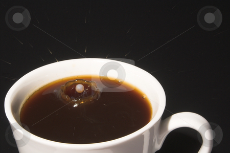 To use this stock image in your creative project, please select the size you need over to the right and click the "Add to Cart" button.
Your downloaded image will come with the Cutcaster watermark removed so don’t worry about the watermark you see on this page. Milk Splash in Coffee stock photo, Drop of milk splashing into a cup of coffee. by Robert Byron
