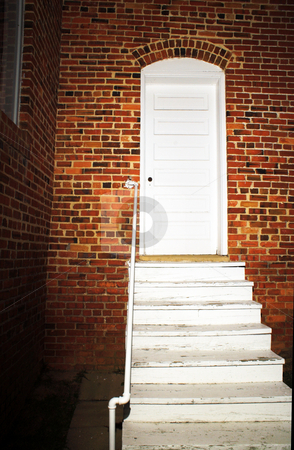 To use this stock image in your creative project, please select the size you need over to the right and click the "Add to Cart" button.
Your downloaded image will come with the Cutcaster watermark removed so don’t worry about the watermark you see on this page. Back Door stock photo, The brightly lit back door of an old church. by Robert Byron