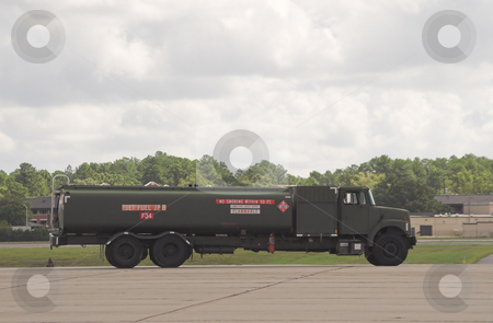 To use this stock image in your creative project, please select the size you need over to the right and click the "Add to Cart" button.
Your downloaded image will come with the Cutcaster watermark removed so don’t worry about the watermark you see on this page. Fuel Truck stock photo, A military fuel truck carrying jet fuel. by Robert Byron