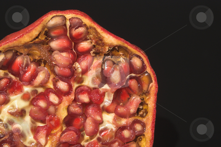 To use this stock image in your creative project, please select the size you need over to the right and click the "Add to Cart" button.
Your downloaded image will come with the Cutcaster watermark removed so don’t worry about the watermark you see on this page. Pomegranate stock photo, The cross section of a fresh pomegranate. by Robert Byron