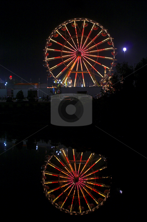 To use this stock image in your creative project, please select the size you need over to the right and click the "Add to Cart" button.
Your downloaded image will come with the Cutcaster watermark removed so don’t worry about the watermark you see on this page. Ferris Wheel stock photo, A large ferris wheel or big wheel at a fair. by Robert Byron