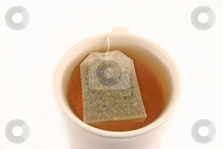 To use this stock image in your creative project, please select the size you need over to the right and click the "Add to Cart" button.
Your downloaded image will come with the Cutcaster watermark removed so don’t worry about the watermark you see on this page. Tea stock photo, Green tea bag in a cup brewing on white background by Jack Schiffer
