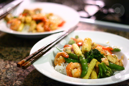 To use this stock image in your creative project, please select the size you need over to the right and click the "Add to Cart" button.
Your downloaded image will come with the Cutcaster watermark removed so don’t worry about the watermark you see on this page. Chinese Stir Fry on White Plate stock photo, Photograph of Shrimp and Tofu Stir Fry on White Plate with Chopsticks; Shallow depth of field. by Andrei Harwell