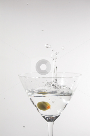 To use this stock image in your creative project, please select the size you need over to the right and click the "Add to Cart" button.
Your downloaded image will come with the Cutcaster watermark removed so don’t worry about the watermark you see on this page. Martini stock photo, A dry martini with a green olive. by Robert Byron