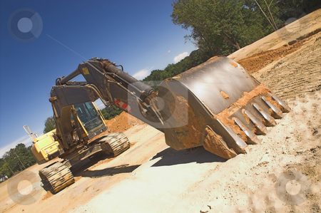 To use this stock image in your creative project, please select the size you need over to the right and click the "Add to Cart" button.
Your downloaded image will come with the Cutcaster watermark removed so don’t worry about the watermark you see on this page. Industrial Excavator stock photo, An industrial excavator at a construction site. by Robert Byron