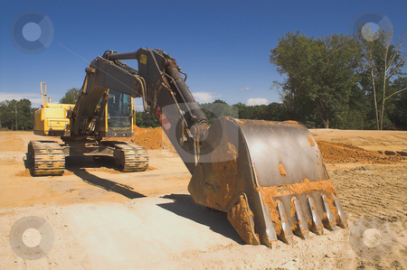 To use this stock image in your creative project, please select the size you need over to the right and click the "Add to Cart" button.
Your downloaded image will come with the Cutcaster watermark removed so don’t worry about the watermark you see on this page. Industrial Excavator stock photo, An industrial excavator at a construction site. by Robert Byron