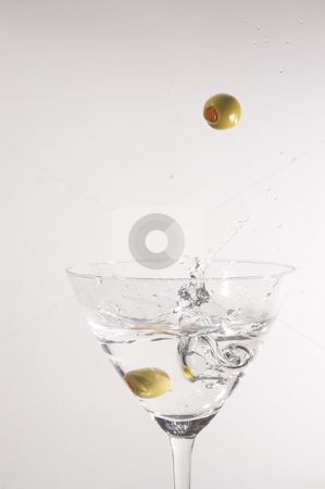 To use this stock image in your creative project, please select the size you need over to the right and click the "Add to Cart" button.
Your downloaded image will come with the Cutcaster watermark removed so don’t worry about the watermark you see on this page. Martini stock photo, A dry martini with a green olive. by Robert Byron