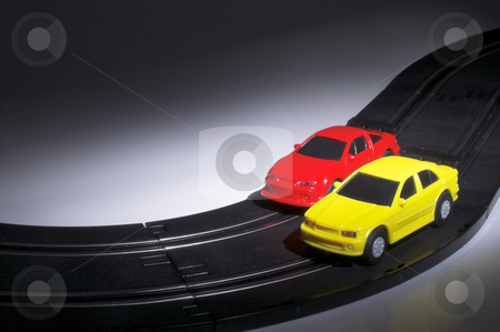 To use this stock image in your creative project, please select the size you need over to the right and click the "Add to Cart" button.
Your downloaded image will come with the Cutcaster watermark removed so don’t worry about the watermark you see on this page. Slot Cars at Night stock photo, Two slot cars racing on a track at night. by Robert Byron