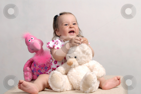 To use this stock image in your creative project, please select the size you need over to the right and click the "Add to Cart" button.
Your downloaded image will come with the Cutcaster watermark removed so don’t worry about the watermark you see on this page. Baby and Toys stock photo, Laughing cute baby with teddy bear and rose flamingo isolated on white background by Valeriy Mazur