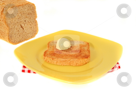 To use this stock image in your creative project, please select the size you need over to the right and click the "Add to Cart" button.
Your downloaded image will come with the Cutcaster watermark removed so don’t worry about the watermark you see on this page. Morning Toast stock photo, Home made wheat bread toast with butter by Jack Schiffer