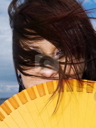 To use this stock image in your creative project, please select the size you need over to the right and click the "Add to Cart" button.
Your downloaded image will come with the Cutcaster watermark removed so don’t worry about the watermark you see on this page. Fan woman stock photo, Woman portrait hiding fan wind yellow long hair by Adrian Costea