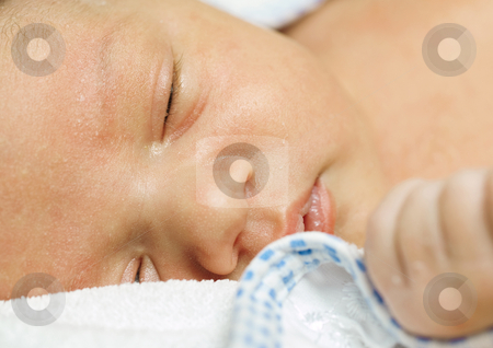 To use this stock image in your creative project, please select the size you need over to the right and click the "Add to Cart" button.
Your downloaded image will come with the Cutcaster watermark removed so don’t worry about the watermark you see on this page. Baby stock photo, New-born baby sleeping on a towel by Adrian Costea
