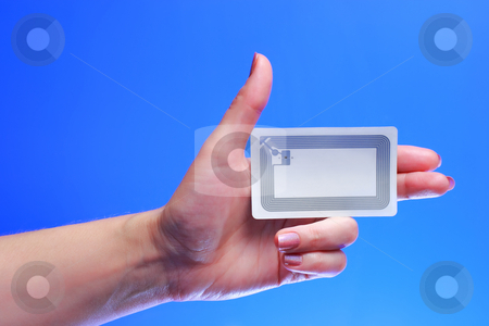 To use this stock image in your creative project, please select the size you need over to the right and click the "Add to Cart" button.
Your downloaded image will come with the Cutcaster watermark removed so don’t worry about the watermark you see on this page. Hand with EPC RFID tag stock photo, A studio shot of a woman holding in her hand Radio-frequency identification (RFID) tag card. Room for text, or your own message.
There is a transponder with antenna and embedded integrated electronic circuit on chip for receiving and transmitting signal with Electronic Product Code (EPC). by Andrey Yanevich