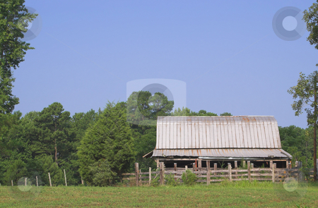To use this stock image in your creative project, please select the size you need over to the right and click the "Add to Cart" button.
Your downloaded image will come with the Cutcaster watermark removed so don’t worry about the watermark you see on this page. Old Barn stock photo, An barn on an old abandoned farm. by Robert Byron