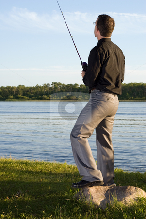 To use this stock image in your creative project, please select the size you need over to the right and click the "Add to Cart" button.
Your downloaded image will come with the Cutcaster watermark removed so don’t worry about the watermark you see on this page. After Work Fishing stock photo, A young businessman at the lake fishing after work by Richard Nelson