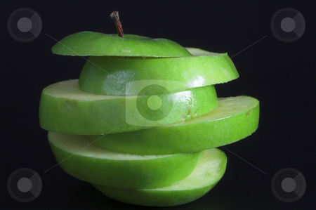 To use this stock image in your creative project, please select the size you need over to the right and click the "Add to Cart" button.
Your downloaded image will come with the Cutcaster watermark removed so don’t worry about the watermark you see on this page. Sliced Apple stock photo, A sliced green apple in a stack. by Robert Byron
