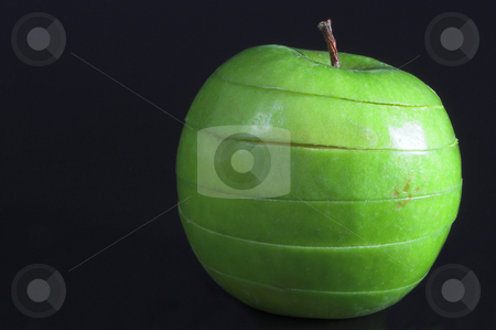 To use this stock image in your creative project, please select the size you need over to the right and click the "Add to Cart" button.
Your downloaded image will come with the Cutcaster watermark removed so don’t worry about the watermark you see on this page. Sliced Apple stock photo, A sliced green apple in a stack. by Robert Byron