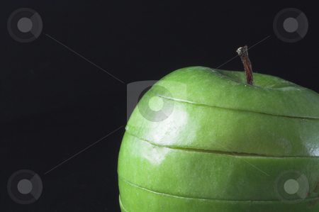 To use this stock image in your creative project, please select the size you need over to the right and click the "Add to Cart" button.
Your downloaded image will come with the Cutcaster watermark removed so don’t worry about the watermark you see on this page. Sliced Apple stock photo, A sliced green apple in a stack. by Robert Byron
