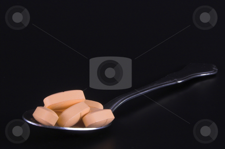 To use this stock image in your creative project, please select the size you need over to the right and click the "Add to Cart" button.
Your downloaded image will come with the Cutcaster watermark removed so don’t worry about the watermark you see on this page. Spoonful of Pills stock photo, A teaspoon spoon filled with prescription pills. by Robert Byron