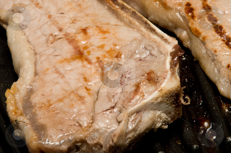 To use this stock image in your creative project, please select the size you need over to the right and click the "Add to Cart" button.
Your downloaded image will come with the Cutcaster watermark removed so don’t worry about the watermark you see on this page. Steak stock photo, Delicious steaks cooking on an inside grill. by Robert Byron