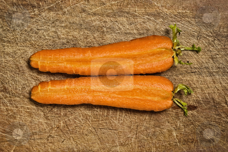 To use this stock image in your creative project, please select the size you need over to the right and click the "Add to Cart" button.
Your downloaded image will come with the Cutcaster watermark removed so don’t worry about the watermark you see on this page. Carrot fresh vegetable stock photo, Cut fresh carrots on old wooden table. by Pablo Caridad