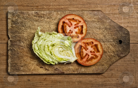 To use this stock image in your creative project, please select the size you need over to the right and click the "Add to Cart" button.
Your downloaded image will come with the Cutcaster watermark removed so don’t worry about the watermark you see on this page. tomatoes and lettuce stock photo, Cut tomatoes and lettuce on cutting table. by Pablo Caridad
